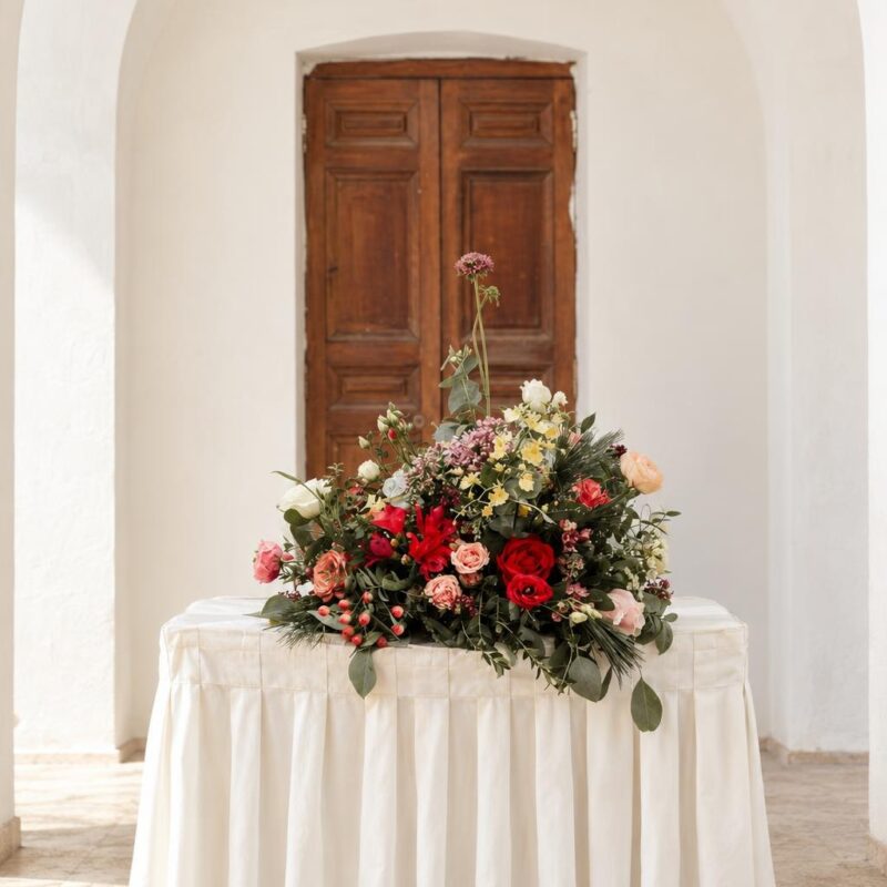 Red Rose & Peach Ranunculus Ceremony Table Arrangement