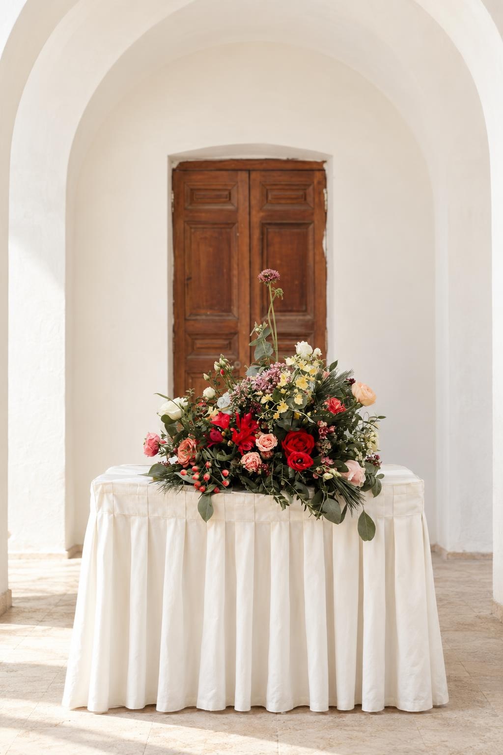 Red Rose & Peach Ranunculus Ceremony Table Arrangement
